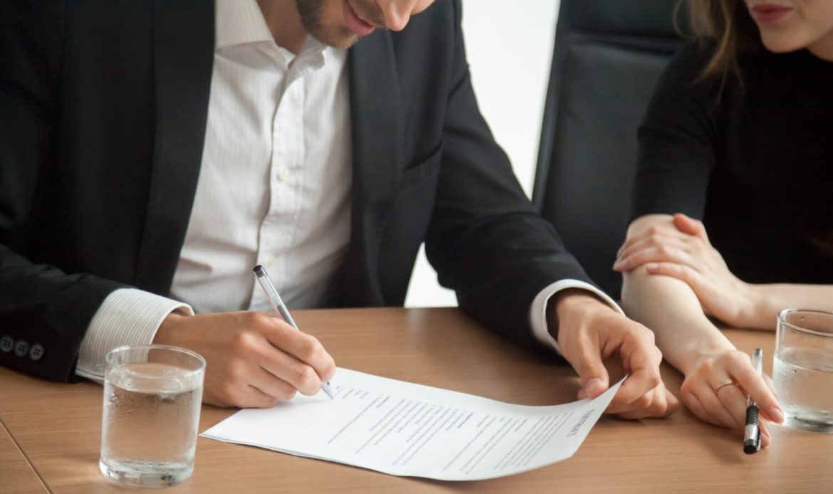 signing on the agreement to buy new home in luxembourg